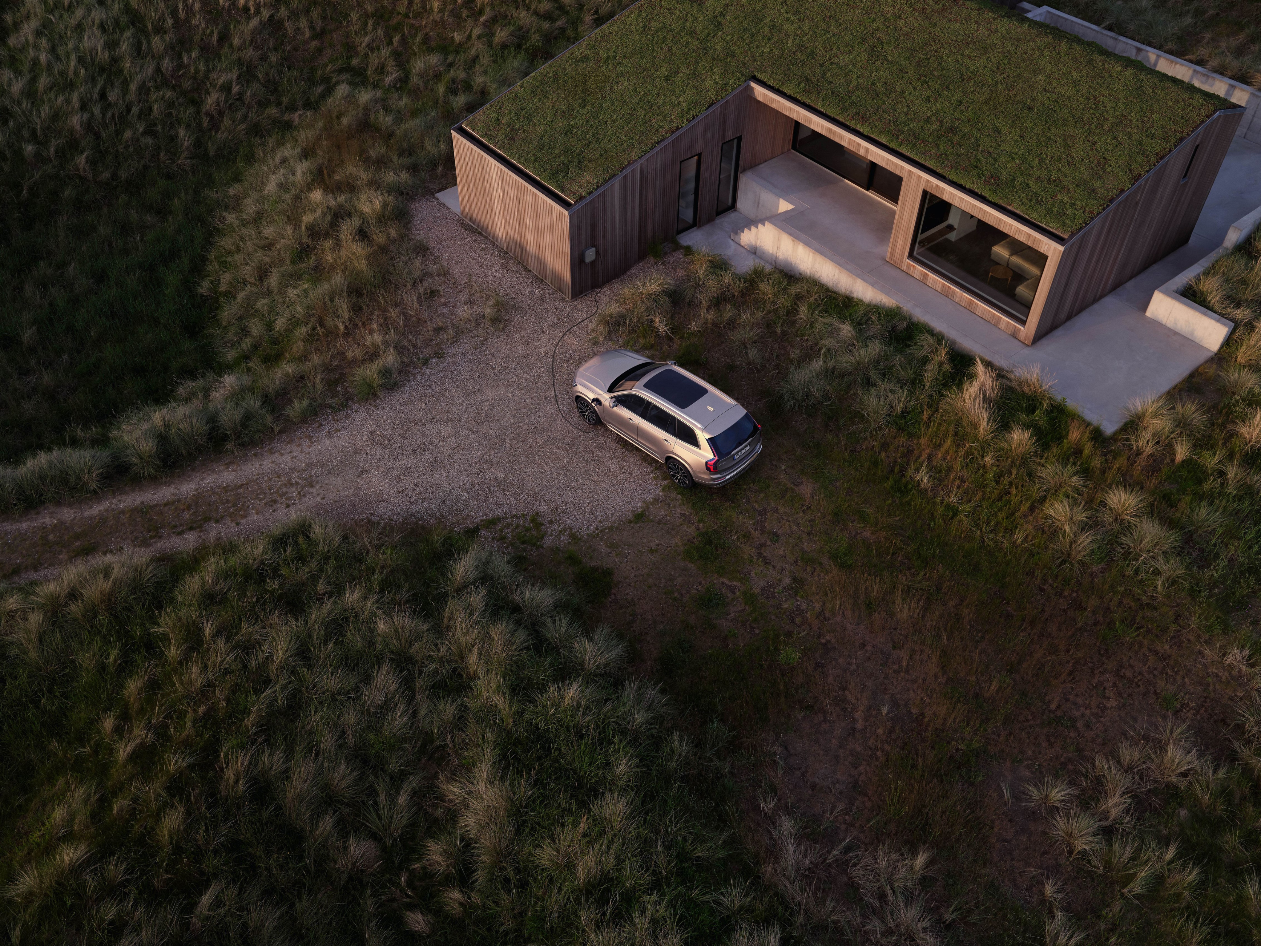 Volvo driving on a country road